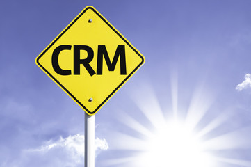CRM road sign with sun background