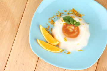 Panna Cotta with orange zest and caramel sauce,