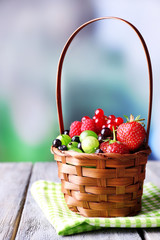 Fototapeta na wymiar Forest berries in wicker basket,