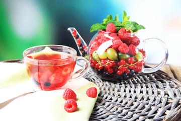 Fruit red tea with wild berries in glass cup,