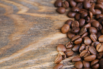 Coffee beans on rustic wooden background