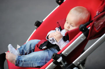 Baby boy playing with his sock