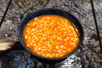 Dutch oven cooking beans - close up