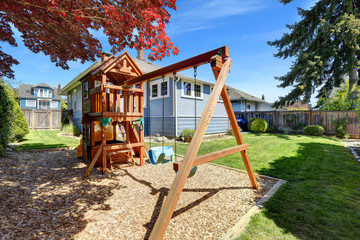 Fototapeta na wymiar House backyard with playground for kids