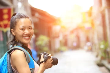 Fotobehang woman photographer/tourist taking photo in guilin,china  © lzf