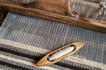 Hungarian traditional homespun. Traditional weaving hand-loom for carpets in Transylvania. - 67907283