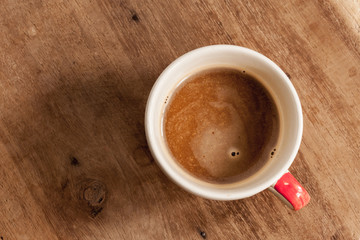 coffee cups on wood background.