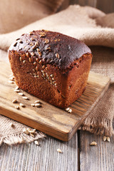 Fresh bread on wooden table, close up