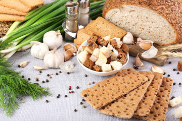 Homemade croutons on table in kitchen, close up
