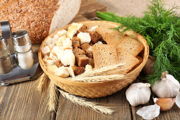 Homemade croutons on table in kitchen, close up