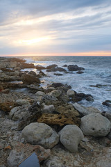Fototapeta na wymiar Sunset on a sea beach
