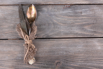 Old vintage silverware on wooden table