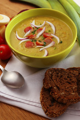 Leek soup on table, close up