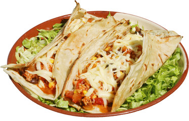 Mexican food served with cheese and green salad in traditional p
