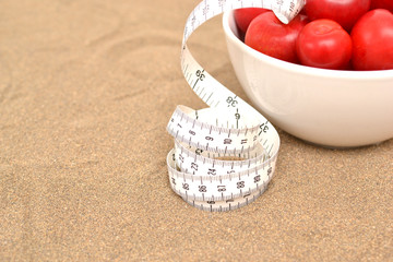 red plums and tape measure