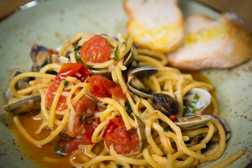 Homemade pasta with seafood and cherry tomatoes