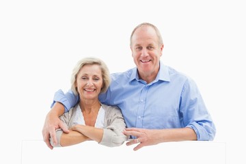 Mature couple smiling at camera