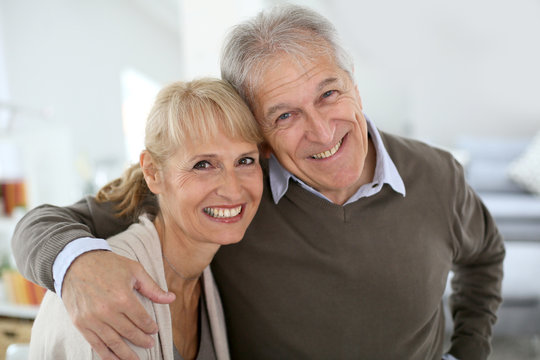 Cheerful senior couple embracing each other