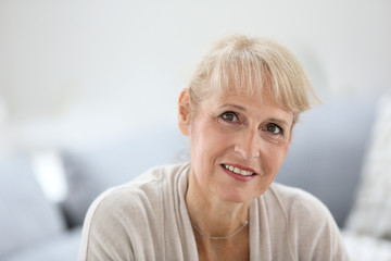 Fototapeta na wymiar Portrait of smiling blond senior woman