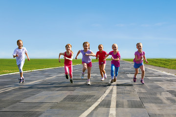 group of children running on the treadmill