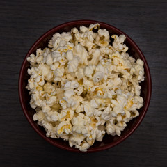 Bowl of Popcorn on Wooden Table top view