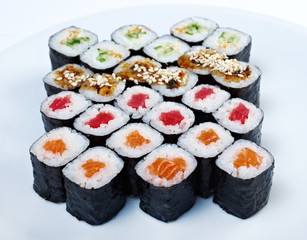 Roll made salmon, eel, tuna, vegetables