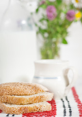 Homemade bread and milk in ceramic mug