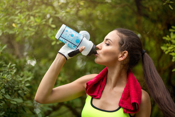 Sporty young brunette having fitness fun outdoors.