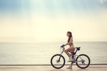 Image of a beautiful girl on the bike