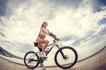 A beautiful girl on the bike