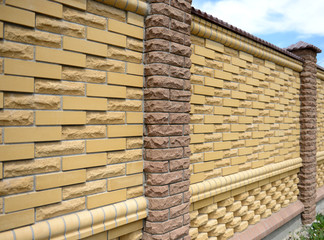 Fence of yellow bricks