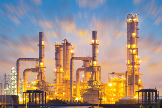 Large oil refinery at Map Ta Phut in Rayong, Thailand with complex steel piping and processing machinery, representing petroleum production, industrial technology, maintenance and energy investment.