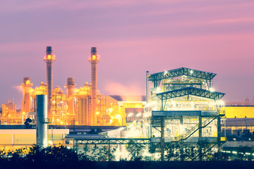 Obraz premium Power plant, gas fired power station. Industrial factory may called combined cycle gas turbine plant or CCGT. Electricity energy generation by natural gas, heat recovery steam generator and boiler.