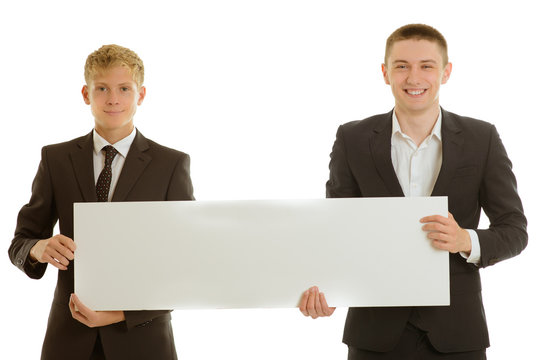 group of two businesspeople holding blank banner