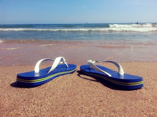 Beach shoes in the sand
