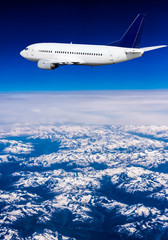 Fototapeta na wymiar Airplane over the clouds 