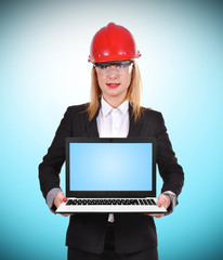 woman engineer holding laptop