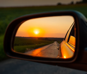 Reflection in the Mirror of the Car and the Sunset.  Landscape Rural Orange  Evening  Highway...
