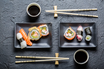Sushi for two served in a black ceramic