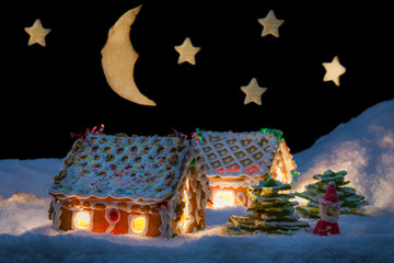 Gingerbread cottage in winter with stars