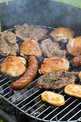 barbecue with delicious grilled meat on grill