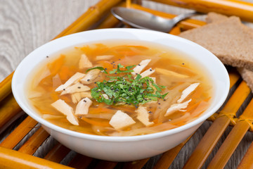 vegetable soup with chicken in a bowl