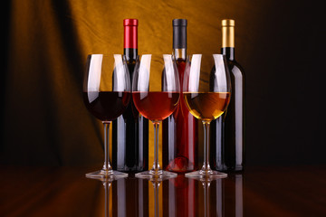 Fototapeta na wymiar Wine glasses and bottles