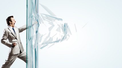 Man breaking glass