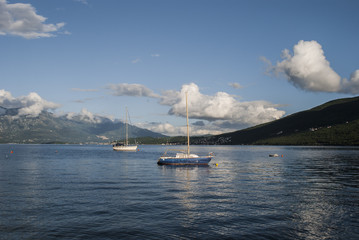 Two sailing boats tied up in a bay
