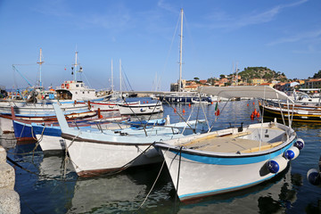 Fototapeta na wymiar Boats in the small harbor of Giglio Island