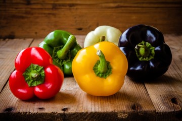 Red, green, black, white and yellow bell peppers
