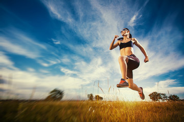 Young woman jogging in nature