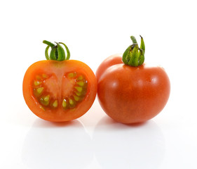Red tomato vegetable on white background.