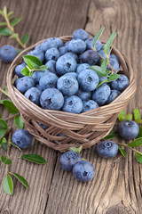 Blueberries over wooden background